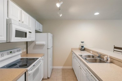 Welcome to this upper-level 2-bedroom, 2-bath condo in the on Charlevoix Golf and Country Club in Michigan - for sale on GolfHomes.com, golf home, golf lot