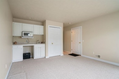 Welcome to this upper-level 2-bedroom, 2-bath condo in the on Charlevoix Golf and Country Club in Michigan - for sale on GolfHomes.com, golf home, golf lot