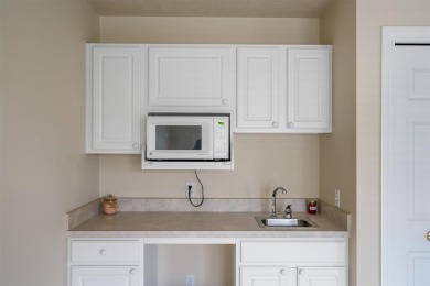 Welcome to this upper-level 2-bedroom, 2-bath condo in the on Charlevoix Golf and Country Club in Michigan - for sale on GolfHomes.com, golf home, golf lot