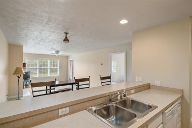 Welcome to this upper-level 2-bedroom, 2-bath condo in the on Charlevoix Golf and Country Club in Michigan - for sale on GolfHomes.com, golf home, golf lot