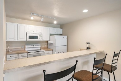 Welcome to this upper-level 2-bedroom, 2-bath condo in the on Charlevoix Golf and Country Club in Michigan - for sale on GolfHomes.com, golf home, golf lot