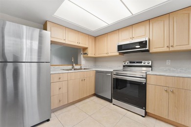 Beautifully updated 1-bedroom, 1.5-bath condo with stunning golf on Cove Cay Country Club in Florida - for sale on GolfHomes.com, golf home, golf lot