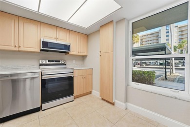 Beautifully updated 1-bedroom, 1.5-bath condo with stunning golf on Cove Cay Country Club in Florida - for sale on GolfHomes.com, golf home, golf lot