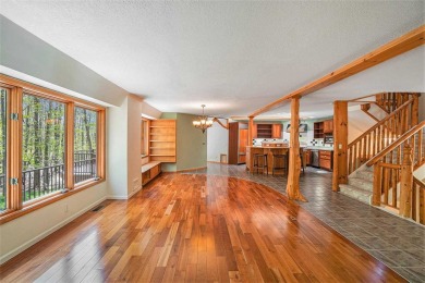 Perched at the crest of a wooded hill, this distinctive on Birchwood Farms Golf and Country Club in Michigan - for sale on GolfHomes.com, golf home, golf lot