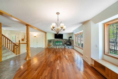 Perched at the crest of a wooded hill, this distinctive on Birchwood Farms Golf and Country Club in Michigan - for sale on GolfHomes.com, golf home, golf lot