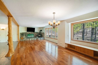 Perched at the crest of a wooded hill, this distinctive on Birchwood Farms Golf and Country Club in Michigan - for sale on GolfHomes.com, golf home, golf lot