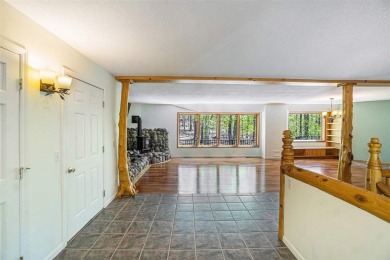 Perched at the crest of a wooded hill, this distinctive on Birchwood Farms Golf and Country Club in Michigan - for sale on GolfHomes.com, golf home, golf lot