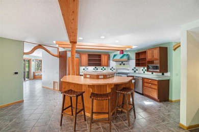 Perched at the crest of a wooded hill, this distinctive on Birchwood Farms Golf and Country Club in Michigan - for sale on GolfHomes.com, golf home, golf lot