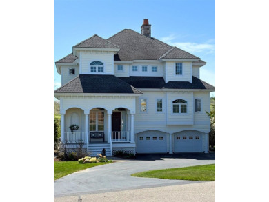 Indulge in the pinnacle of elegance and serenity with this on Bay Harbor Golf Club in Michigan - for sale on GolfHomes.com, golf home, golf lot