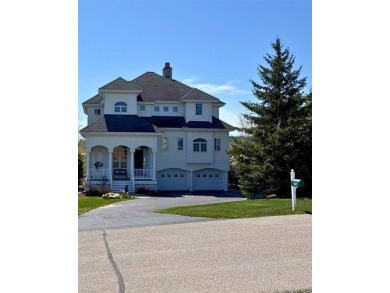 Indulge in the pinnacle of elegance and serenity with this on Bay Harbor Golf Club in Michigan - for sale on GolfHomes.com, golf home, golf lot