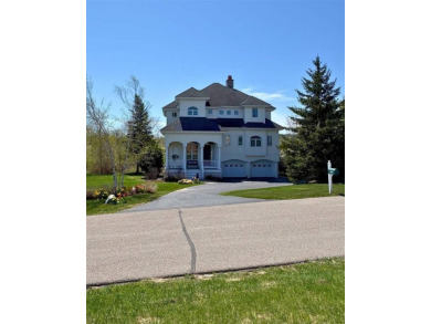 Indulge in the pinnacle of elegance and serenity with this on Bay Harbor Golf Club in Michigan - for sale on GolfHomes.com, golf home, golf lot