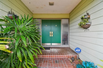 One-of-a-Kind Mid-Century home located on nearly one acre of on Rolling Hills Golf Club in Florida - for sale on GolfHomes.com, golf home, golf lot