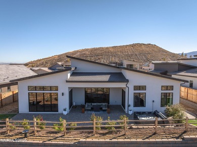 Welcome to this contemporary Somersett home located in the gated on Somersett Country Club in Nevada - for sale on GolfHomes.com, golf home, golf lot