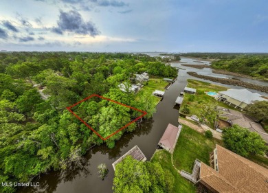 Waterfront lot on canal of bayou in the infamous Gulf Hills on Gulf Hills Golf Club in Mississippi - for sale on GolfHomes.com, golf home, golf lot
