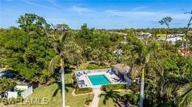 2 Bed + Den | 2 Bath | End-Unit Condo with Water & Golf Course on The Forest Country Club in Florida - for sale on GolfHomes.com, golf home, golf lot