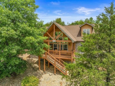 Welcome to your dream getaway at Stonebridge Lodge! This on Ledgestone Country Club and Golf Course in Missouri - for sale on GolfHomes.com, golf home, golf lot