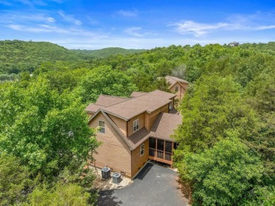 Welcome to your dream getaway at Stonebridge Lodge! This on Ledgestone Country Club and Golf Course in Missouri - for sale on GolfHomes.com, golf home, golf lot