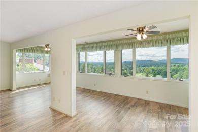 Million Dollar Views and morning sunrises from behind the on Hendersonville Country Club in North Carolina - for sale on GolfHomes.com, golf home, golf lot