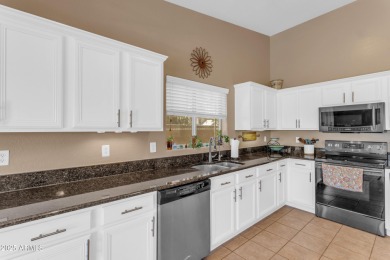 This single level home in The Villages at Queen Creek sits on a on Las Colinas Golf Club in Arizona - for sale on GolfHomes.com, golf home, golf lot