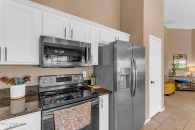 This single level home in The Villages at Queen Creek sits on a on Las Colinas Golf Club in Arizona - for sale on GolfHomes.com, golf home, golf lot