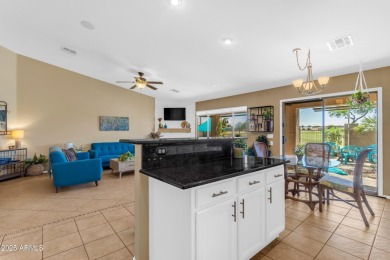 This single level home in The Villages at Queen Creek sits on a on Las Colinas Golf Club in Arizona - for sale on GolfHomes.com, golf home, golf lot