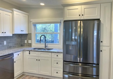 Completely remodeled 1987 Redmen residence with 2 beds, 2 baths on Lake Fairways Country Club in Florida - for sale on GolfHomes.com, golf home, golf lot