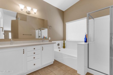 This single level home in The Villages at Queen Creek sits on a on Las Colinas Golf Club in Arizona - for sale on GolfHomes.com, golf home, golf lot