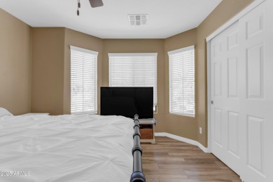 This single level home in The Villages at Queen Creek sits on a on Las Colinas Golf Club in Arizona - for sale on GolfHomes.com, golf home, golf lot