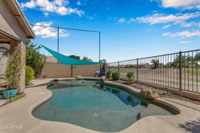 This single level home in The Villages at Queen Creek sits on a on Las Colinas Golf Club in Arizona - for sale on GolfHomes.com, golf home, golf lot