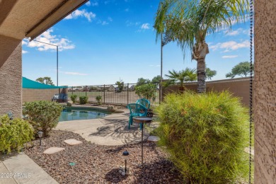 This single level home in The Villages at Queen Creek sits on a on Las Colinas Golf Club in Arizona - for sale on GolfHomes.com, golf home, golf lot
