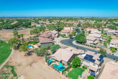 This single level home in The Villages at Queen Creek sits on a on Las Colinas Golf Club in Arizona - for sale on GolfHomes.com, golf home, golf lot