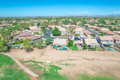This single level home in The Villages at Queen Creek sits on a on Las Colinas Golf Club in Arizona - for sale on GolfHomes.com, golf home, golf lot