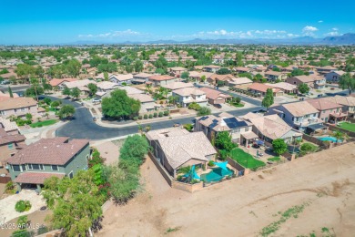 This single level home in The Villages at Queen Creek sits on a on Las Colinas Golf Club in Arizona - for sale on GolfHomes.com, golf home, golf lot