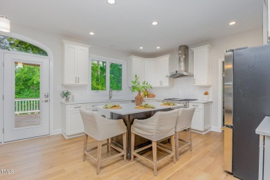 The heart of the home is a gorgeous custom kitchen with sleek on Brier Creek Country Club in North Carolina - for sale on GolfHomes.com, golf home, golf lot