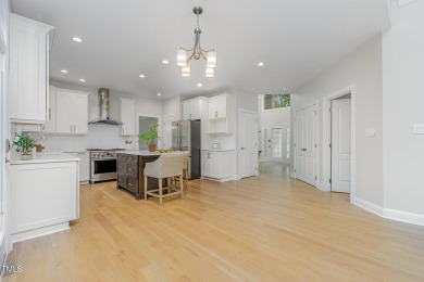 The heart of the home is a gorgeous custom kitchen with sleek on Brier Creek Country Club in North Carolina - for sale on GolfHomes.com, golf home, golf lot
