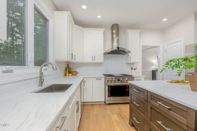 The heart of the home is a gorgeous custom kitchen with sleek on Brier Creek Country Club in North Carolina - for sale on GolfHomes.com, golf home, golf lot