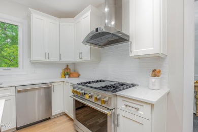 The heart of the home is a gorgeous custom kitchen with sleek on Brier Creek Country Club in North Carolina - for sale on GolfHomes.com, golf home, golf lot