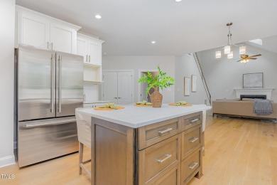 The heart of the home is a gorgeous custom kitchen with sleek on Brier Creek Country Club in North Carolina - for sale on GolfHomes.com, golf home, golf lot