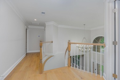 The heart of the home is a gorgeous custom kitchen with sleek on Brier Creek Country Club in North Carolina - for sale on GolfHomes.com, golf home, golf lot