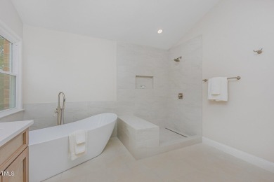 The heart of the home is a gorgeous custom kitchen with sleek on Brier Creek Country Club in North Carolina - for sale on GolfHomes.com, golf home, golf lot