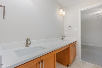 The heart of the home is a gorgeous custom kitchen with sleek on Brier Creek Country Club in North Carolina - for sale on GolfHomes.com, golf home, golf lot