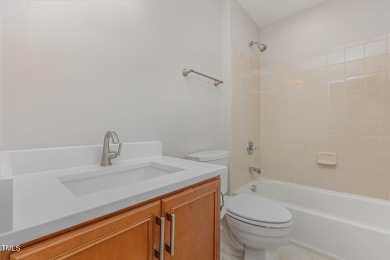 The heart of the home is a gorgeous custom kitchen with sleek on Brier Creek Country Club in North Carolina - for sale on GolfHomes.com, golf home, golf lot