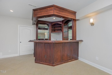The heart of the home is a gorgeous custom kitchen with sleek on Brier Creek Country Club in North Carolina - for sale on GolfHomes.com, golf home, golf lot