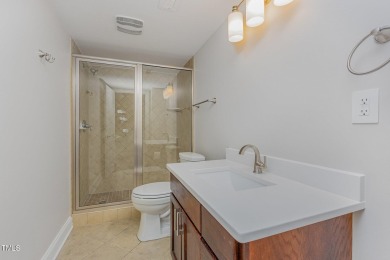 The heart of the home is a gorgeous custom kitchen with sleek on Brier Creek Country Club in North Carolina - for sale on GolfHomes.com, golf home, golf lot