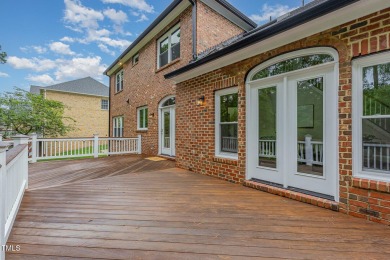 The heart of the home is a gorgeous custom kitchen with sleek on Brier Creek Country Club in North Carolina - for sale on GolfHomes.com, golf home, golf lot
