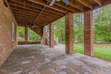The heart of the home is a gorgeous custom kitchen with sleek on Brier Creek Country Club in North Carolina - for sale on GolfHomes.com, golf home, golf lot