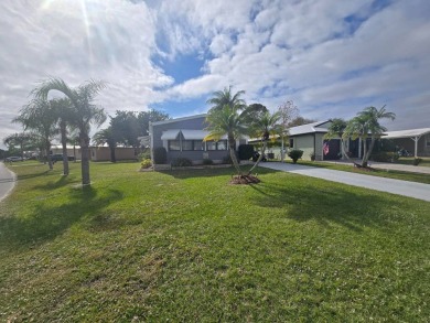 This beautifully furnished 1,344 sq. ft. home offers comfort and on Spanish Lakes Country Club in Florida - for sale on GolfHomes.com, golf home, golf lot