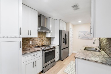 Beautifully updated 1,426 sqft two-story townhouse in the on Boca Lago Golf and Country Club in Florida - for sale on GolfHomes.com, golf home, golf lot