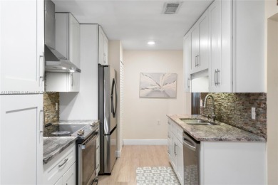 Beautifully updated 1,426 sqft two-story townhouse in the on Boca Lago Golf and Country Club in Florida - for sale on GolfHomes.com, golf home, golf lot