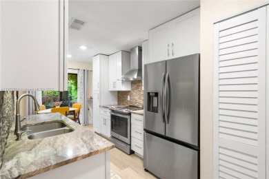 Beautifully updated 1,426 sqft two-story townhouse in the on Boca Lago Golf and Country Club in Florida - for sale on GolfHomes.com, golf home, golf lot